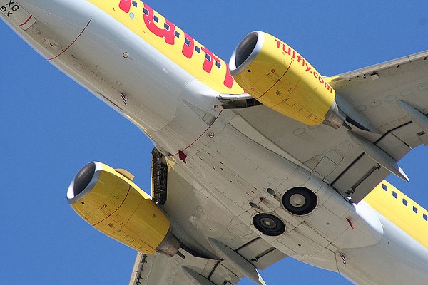  A TUIfly Boeing 737-7K5 (D-AHXG) showing open retracted landing gear. 